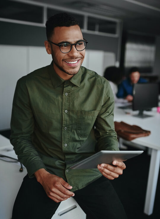 A person is smiling and looking to anyone