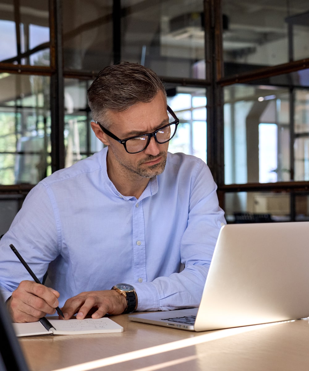 mba exchange background man is checking someting on laptop