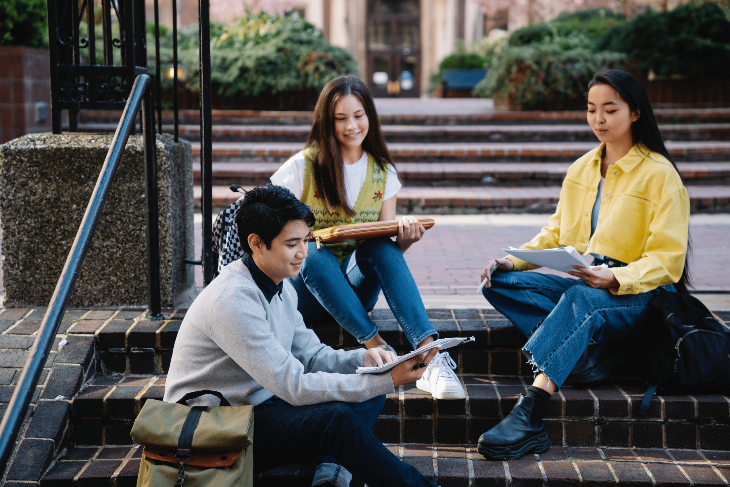 A group of student studying on college stairs