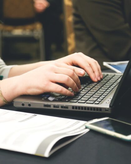 A woman working on laptop in office