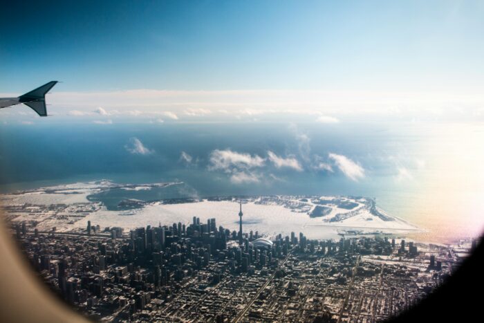 Airplane view of Toronto on the water during the day