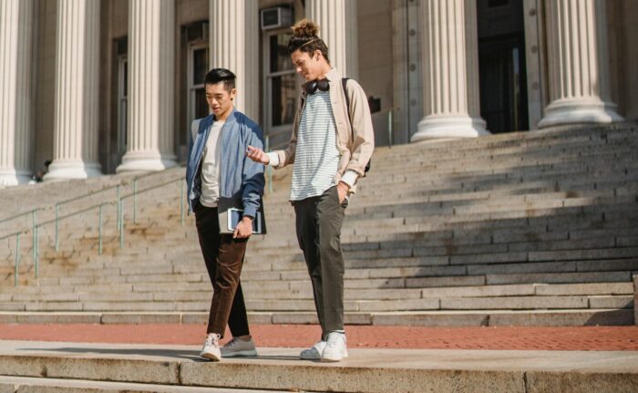two students on the stairs of the met at Columbia University