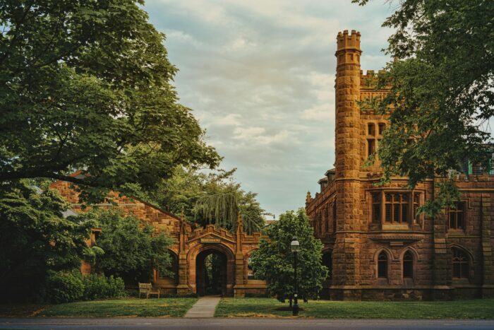Old Princeton University buildings surrounded by green trees and foliage