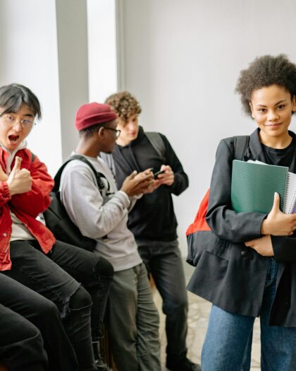 Diverse group of college students hanging out near window
