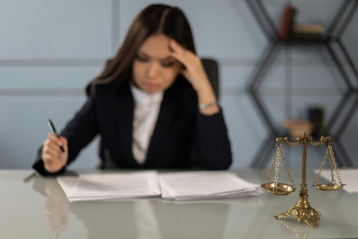 An Exhausted Lawyer Reading the Case Paper