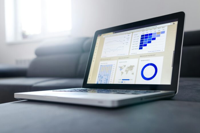 Laptop showing various graphs