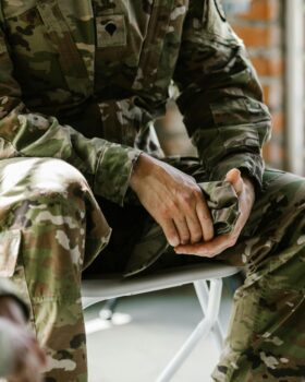 Photo of Person in Green and Brown Camouflage Uniform