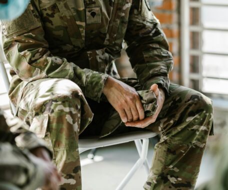 Photo of Person in Green and Brown Camouflage Uniform