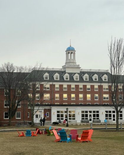 Wooden Chairs on Grass in Park at Tufts University in Medford in USA