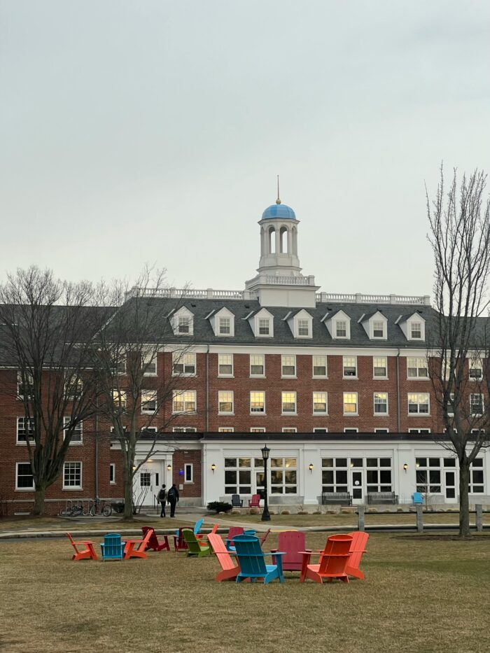 Wooden Chairs on Grass in Park at Tufts University in Medford in USA