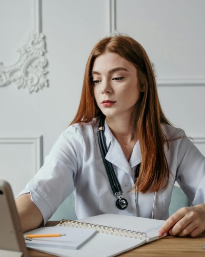 A Medical Doctor Working Behind a Desk