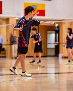 A Boy Playing Badminton