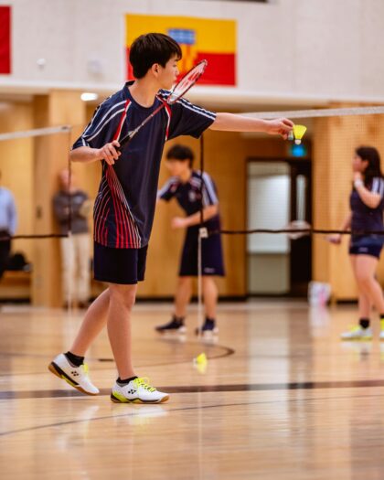 A Boy Playing Badminton