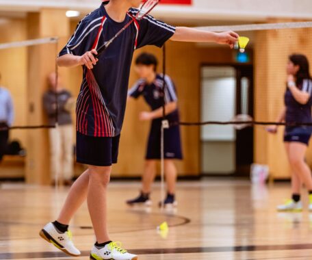 A Boy Playing Badminton
