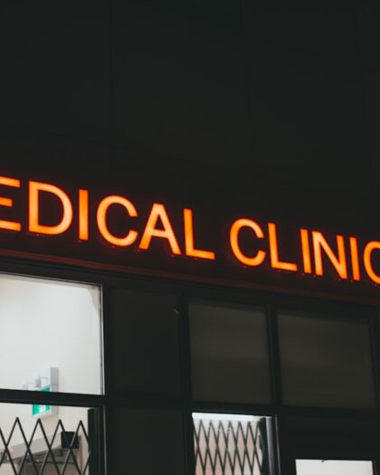 Neon sign displaying the words "Medical Clinic" in bright colors against a dark background.
