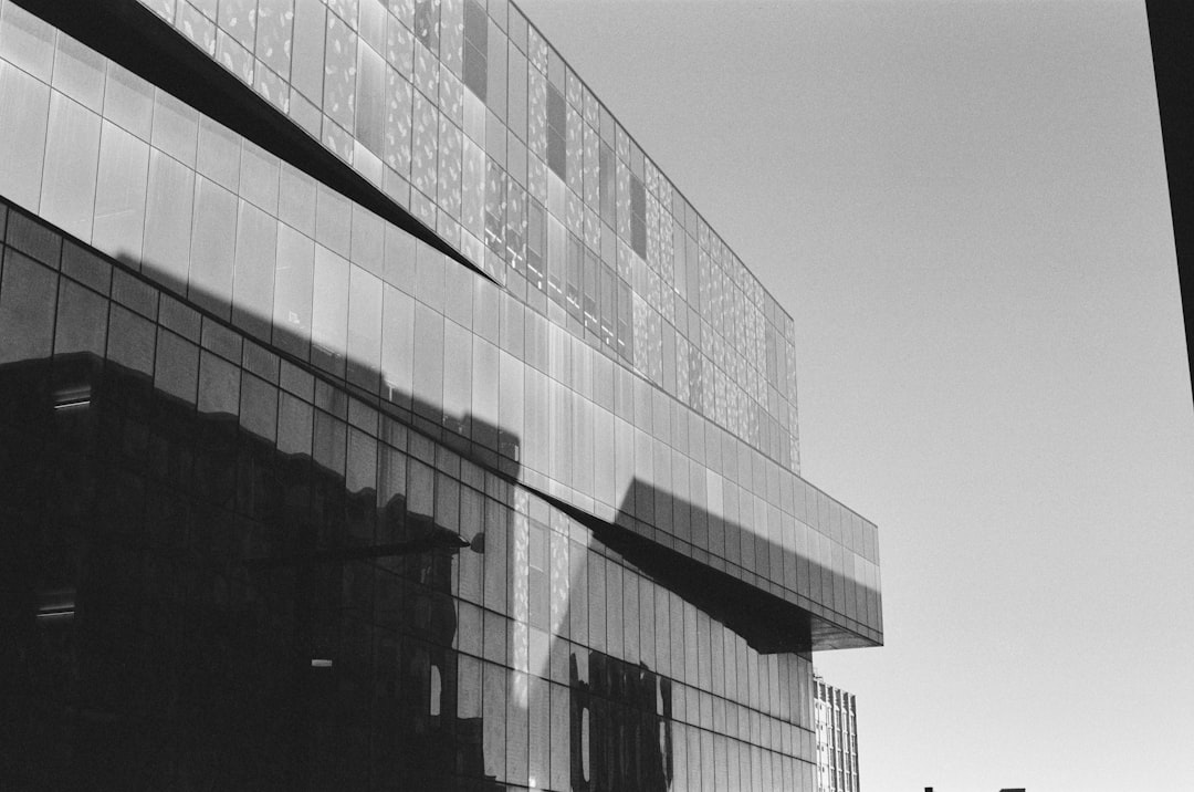 A modern building reflects the sun's bright light.