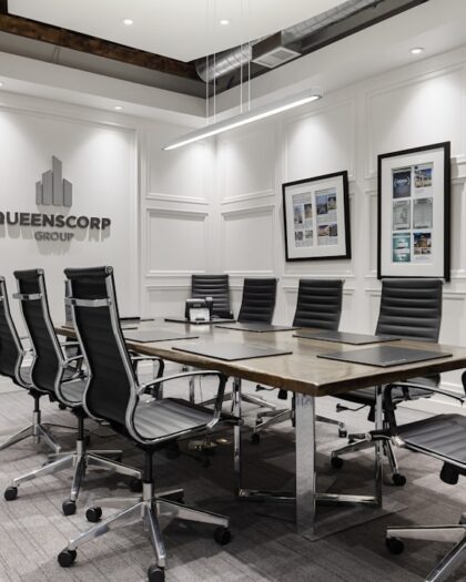 a conference room with a table and chairs